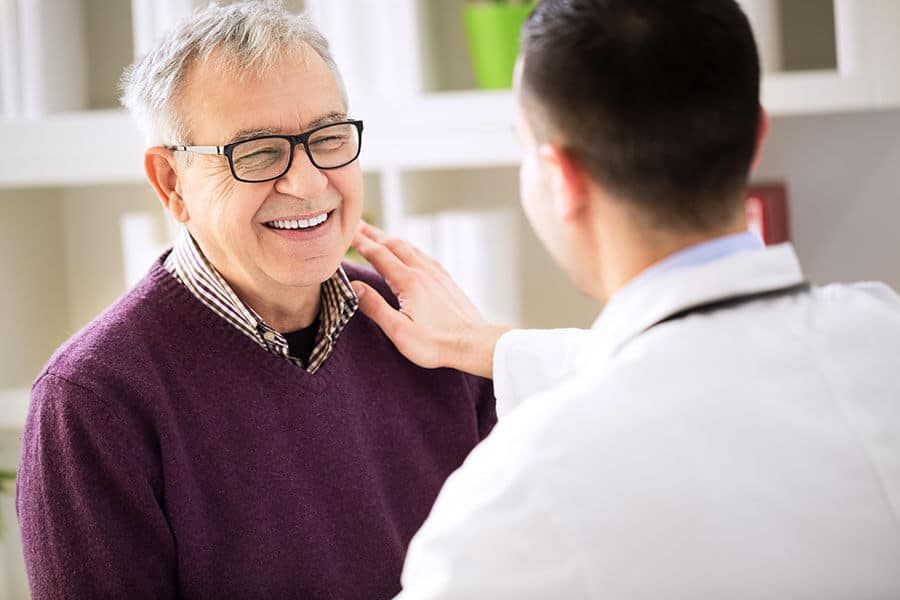 Eye doctor talking with a patient