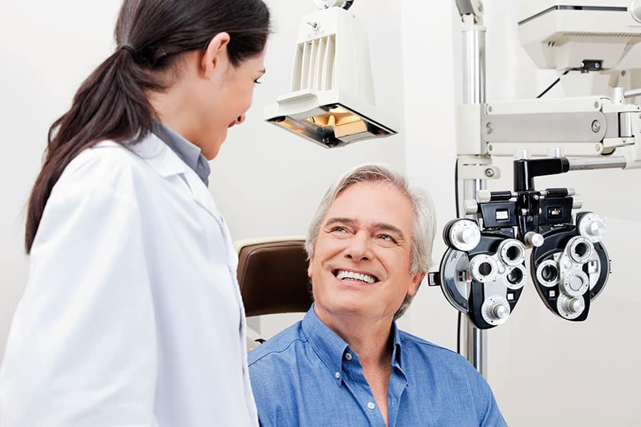 Eye doctor with an older patient